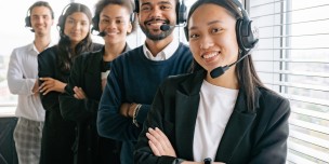Happy Call Center Agents Looking at Camera